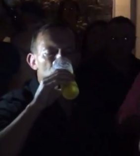 Tony Abbott skulls a beer at a Sydney pub earlier in 2015.