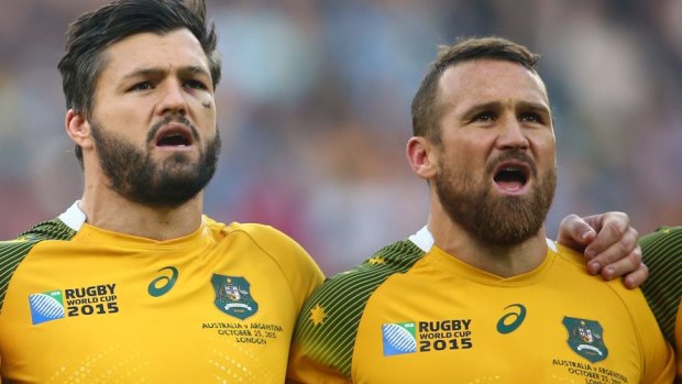 Went off injured: Matt Giteau, right, pictured singing the national anthem at the start of the match with try-scoring hero Adam Ashley-Cooper.
