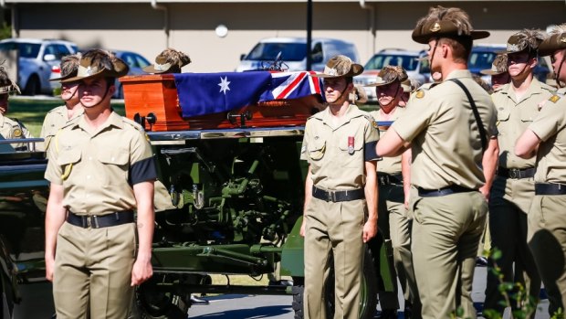 Australian Army soldiers from 2nd/14th Light Horse Regiment (Queensland Mounted Infantry) escort the coffin of the late Trooper Stuart Reddan during a military funeral in Buderim.