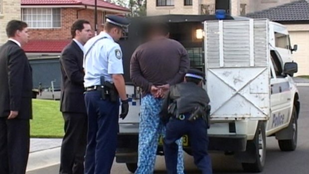 Adnan "Eddie" Darwiche being arrested in 2003. 