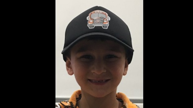 Wests Tigers fan William sports his On The Bus hat.