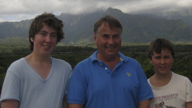 Thomas Kelly, left, with his father Ralph and brother Stuart. 