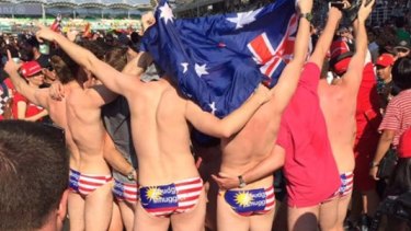 Australians arrested in Malaysia for stripping down at the Grand Prix. 