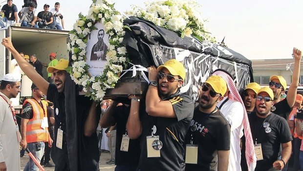 Shiite Muslims carry the coffin of a Saudi man killed in the Dammam mosque bombing.