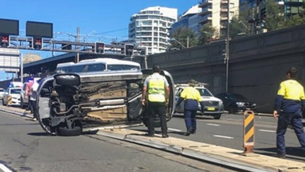 The car flipped North Sydney side of the Harbour Bridge. 