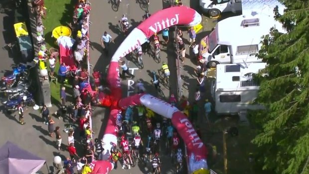 An inflatable archway collapses on Tour de France riders.