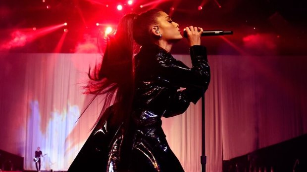 Ariana Grande singing live as part of her Dangerous Woman tour.