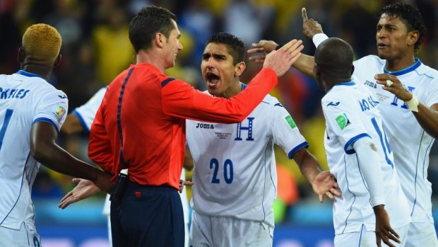 Goal chalked off: Honduras players appeal to referee Benjamin Williams.