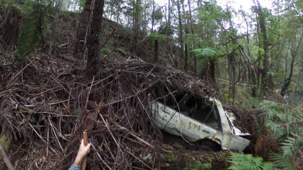 A car wreck in the Yarra bank, off Woods Point Road near Warburton.