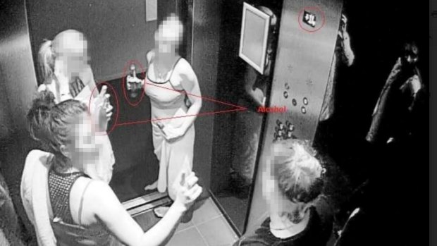 A CCTV still submitted to the inquiry shows short-stay guests at a Melbourne apartment tower in February. Image shows guests in bathing costumes, with alcohol in the lift in the early hours of the morning.