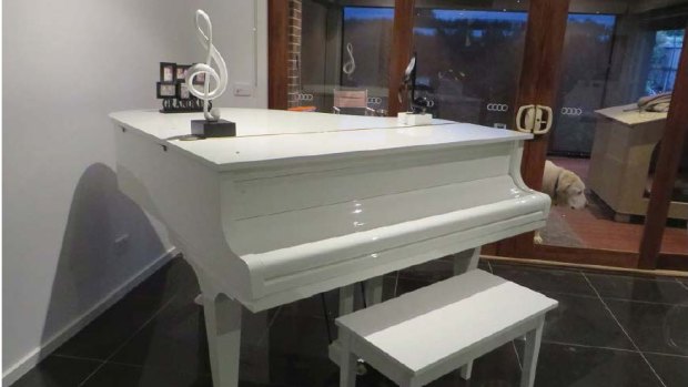 The conspirators spent their ill-gotten gains on various luxury items including this baby grand piano.
