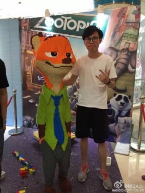 Before: The Nick Wilde Lego statue, with creator Zhao.