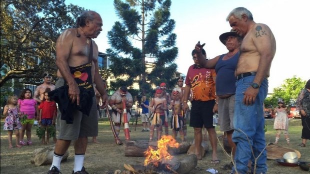 Indigenous elders at a smoking ceremony in Musgrave Park on Sunday afternoon.