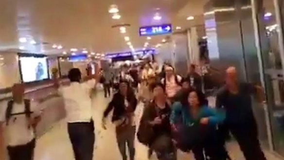 Travellers in airport fleeing the blasts, caught on CCTV.