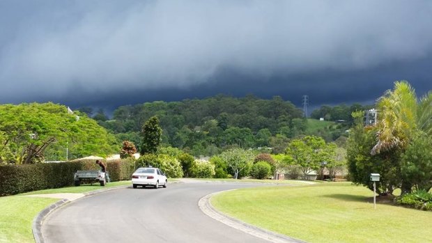 Storms are building in south-east Queensland on Saturday afternoon.  Paul Cass captured the clouds gathering behind Cooroy, as shared by Higgins Storm Chasing.