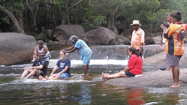 Queensland Police officers John Melandri (left) and Wil Devlin during their induction into the Kuku-Yalanji Clan.