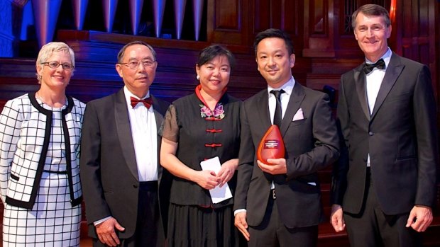 Media specialist Takeshi Takada is given his award.
