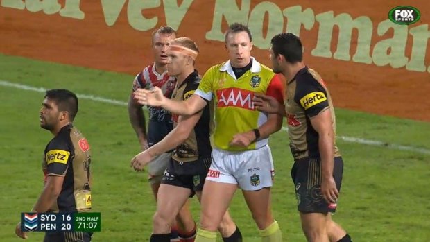 Touching situation: Sam McKendry touches referee Jared Maxwell during Monday night's game against the Sydney Roosters.