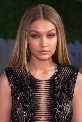 Gigi Hadid made up in muted Burgundy colours for a strong but subtle mono look.