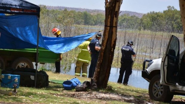 Police and QFES workers begin the search for nine-year-old Tobi Parkes after a jet ski accident at Lake Moondarra, in central Queensland.