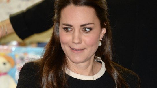 Catherine, Duchess of Cambridge takes part in gift wrapping with volunteers as she visits Northside Center for Child Development in New York City. Photo: Samir Hussein
