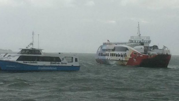 Stradbroke Ferries' Big red Cat ran aground just before low tide on Monday, stranding more than 200 holiday makers onboard overnight.