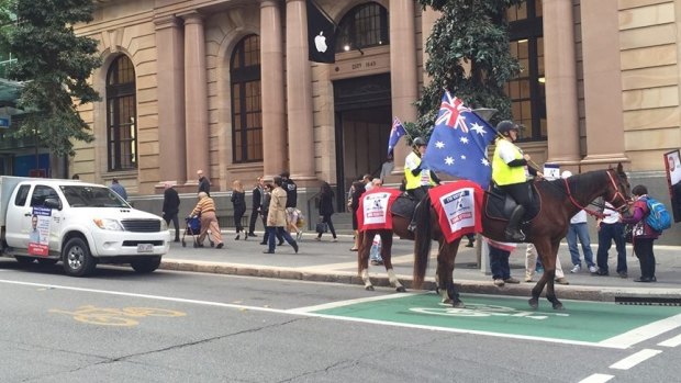 The riders ignored red lights at a George Street crossing.