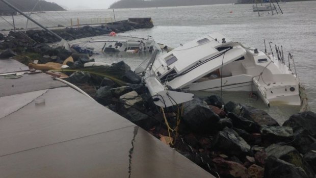 Sunken boats line the shore at Shute Harbour, near Airlie Beach.