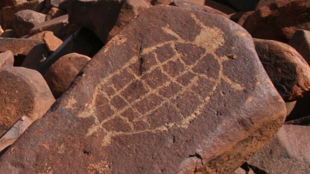 An engraving of a sea turtle on the Burrup Peninsula, Western Australia. 