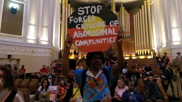 Protesters occupy Brisbane's City Hall to object to the closure of remote Aboriginal communities.