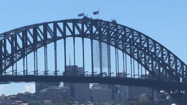 Flags at half-mast on the Sydney Harbour Bridge on Saturday.