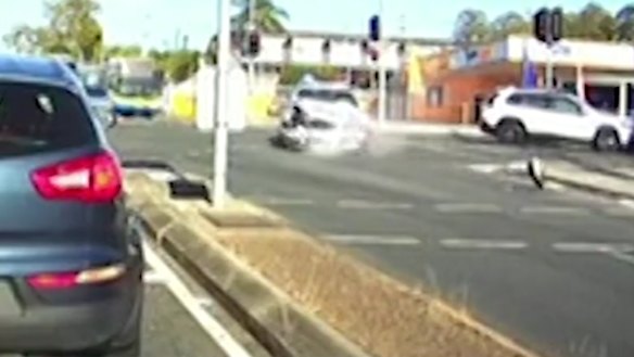 Dashcam captures police car crash at Brisbane intersection