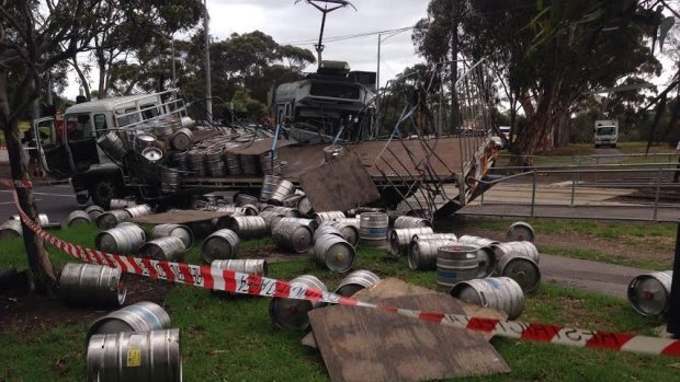 Carlton & United Breweries kegs were left strewn over the road and footpath.