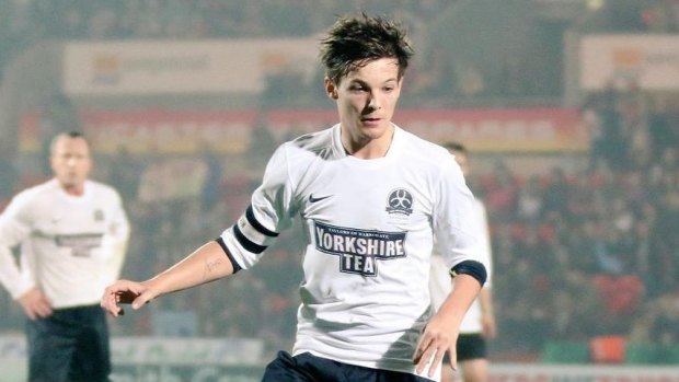 One Direction member Louis Tomlinson is also a talented football player.