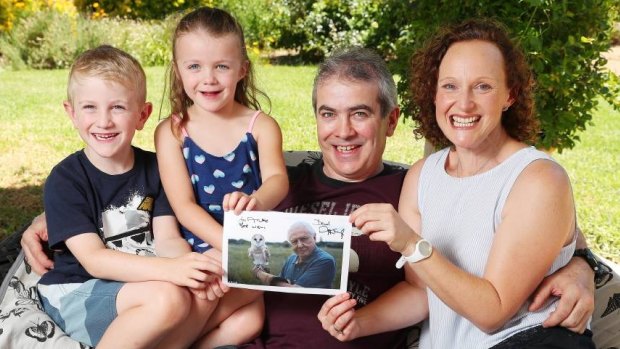 Good manners rewarded: Archie with his little sister Amelie and parents Shane and Toni Comerford, holding the prized signed photograph.