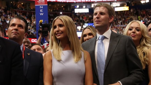 Donald Trump's children, from left to right, Donald Jr., Ivanka, Eric and Tiffany (peering over her half-brother's shoulder) at the Republican National Convention, in Cleveland in July.