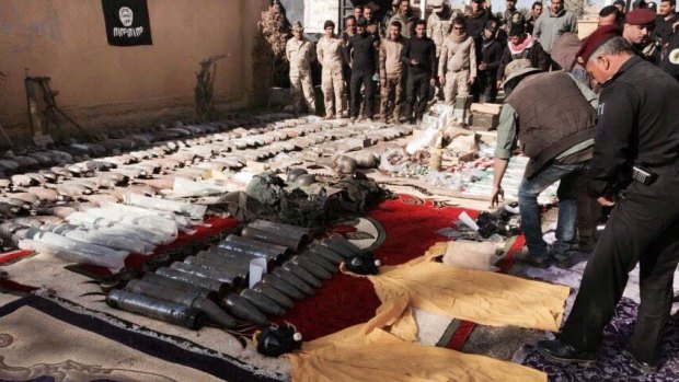 The Iraqi military has made significant gains against Islamic State fighters in and around Ramadi. Iraqi security forces display confiscated weapons and ammunition.