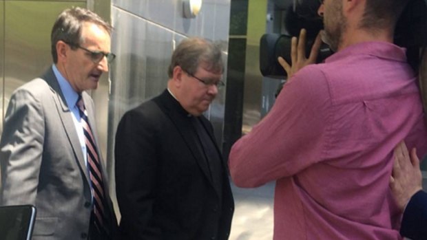 Father Walshe leaves the  Royal Commission into Institutional Responses to Child Sexual Abuse last year.