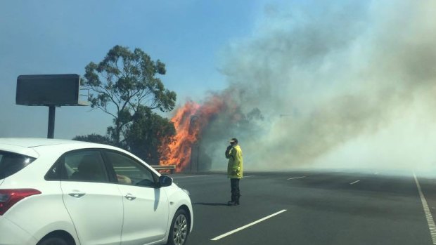 Flames seen from the Princes Freeway on Tuesday afternoon.