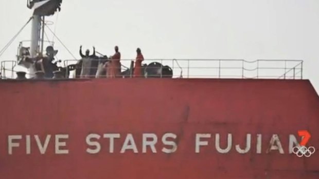 Crew aboard the Five Stars Fujian during their extended stay off the coast of Queensland.