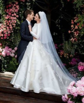 Evan Spiegel and Miranda Kerr, dressed in Dior, on their wedding day.