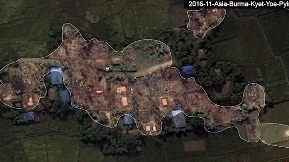 The village after the attacks with buildings and trees burnt and missing.