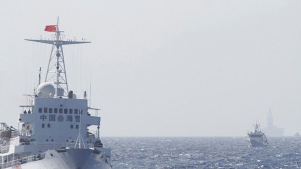 Chinese Coast Guard ships are seen near the Chinese oil rig Haiyang Shi You 981 in disputed waters in the South China Sea.