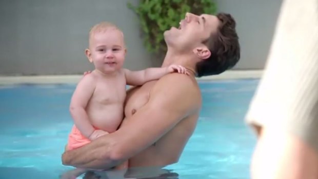 Matty J topless holding his baby nephew.