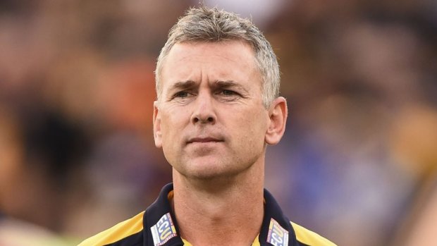 Reality check: West Coast coach Adam Simpson watched his team get played off the park by reigning premiers Hawthorn.