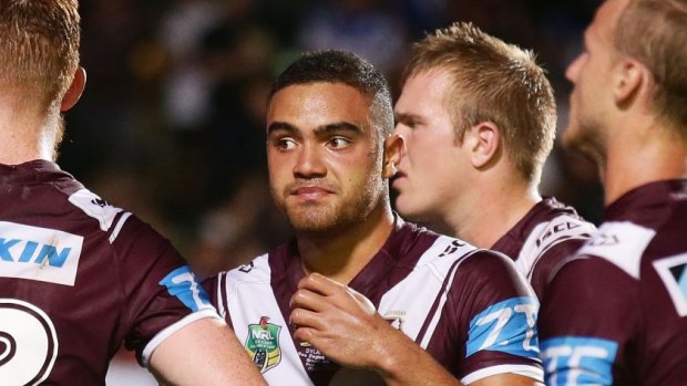 Walloped: The Manly players try to regather their thoughts.