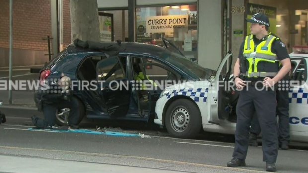 A driver rammed a car into police on Bourke Street on Tuesday, police said.