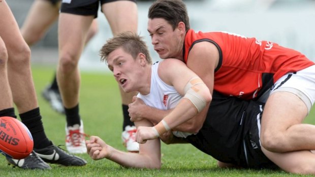 Boland them over: Nick Boland (right) playing for Frankston in the VFL.