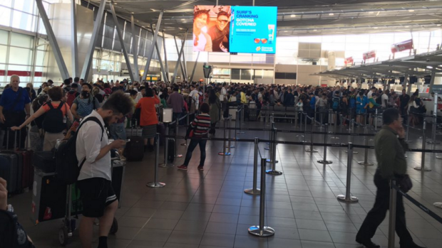 Long queues at Sydney Airport after the Virgin ticket system went down