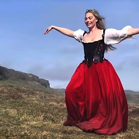 Margot Robbie dances to the Kate Bush hit.